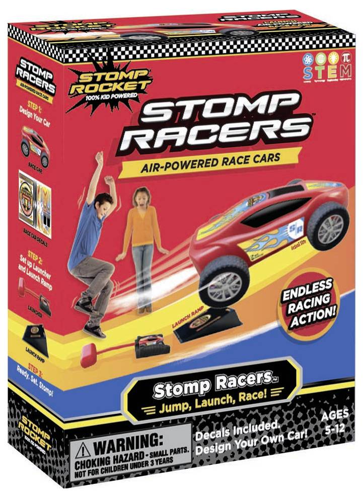 Eine Spielzeugverpackung, 'Stomp Racers', zeigt ein Kind, das auf ein Luftkissen tritt, um ein Rennauto anzutreiben. Ab 5 Jahren.