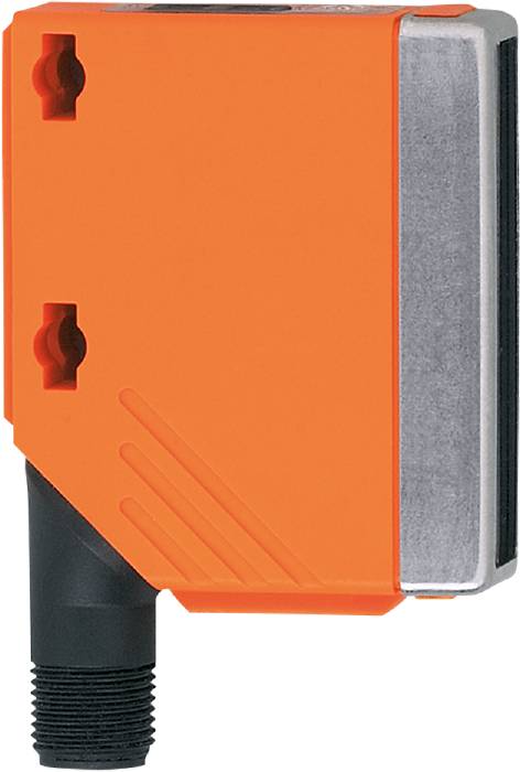 Ein orangefarbenes Bauteil mit einer schwarzen Leitung, möglicherweise ein Sensorgerät, zeigt auf einem industriellen Hintergrund.