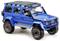 Blaues Geländewagen-Modellauto mit schwarzem Dach, großen Reifen und roten Akzenten.