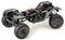 Ferngesteuertes Fahrzeug-Chassis ohne Karosserie; zeigt Federung, Reifen und Verkabelung für Offroad-Modelle.
