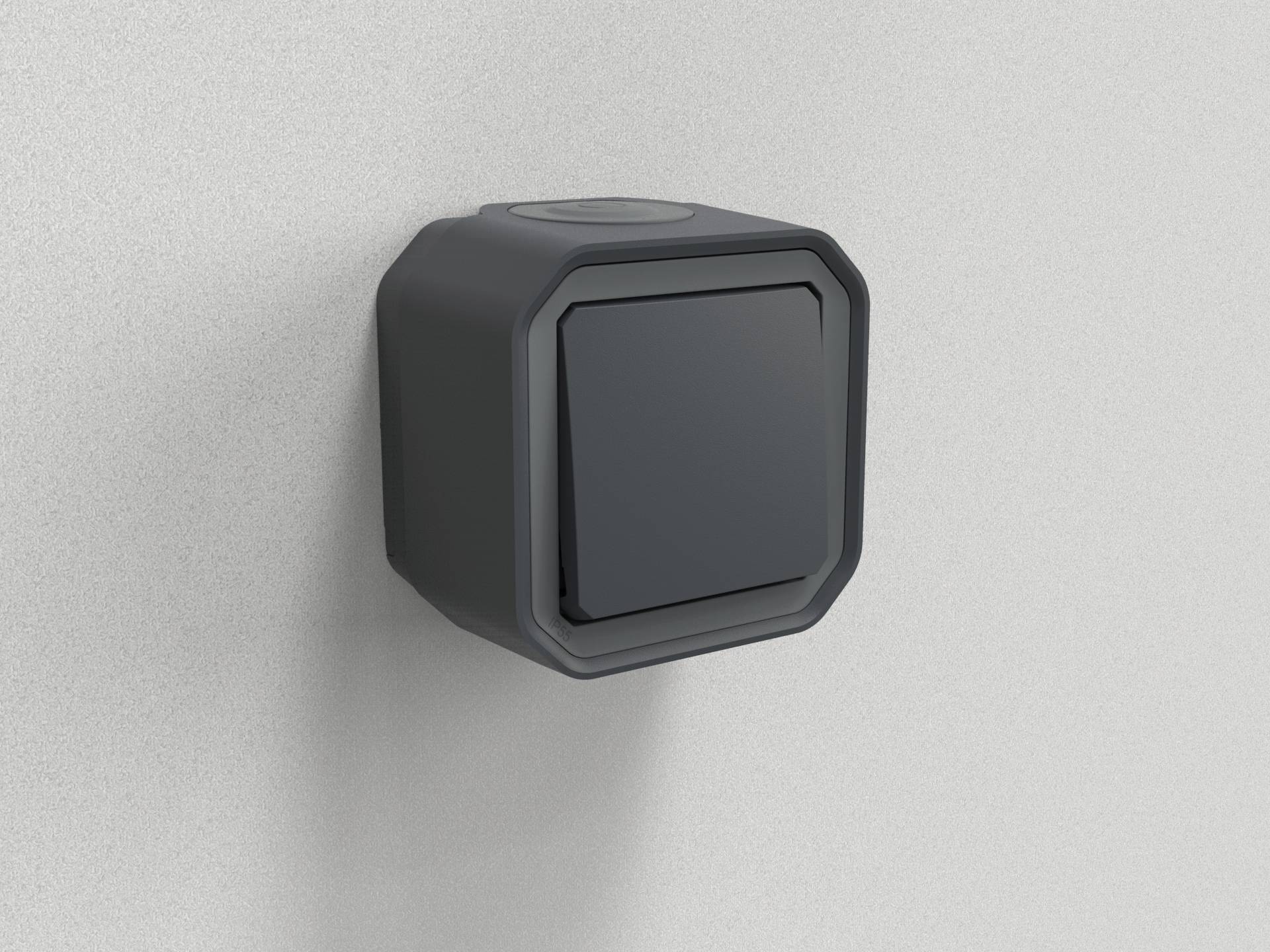 Ein grauer, quadratischer Lichtschalter in einem modernen Design, an einer hellgrauen Wand befestigt.