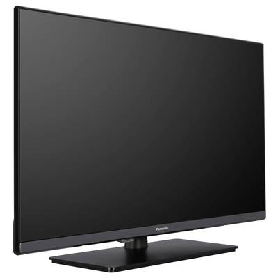 Ein schwarzer Flachbildfernseher mit Metallfuß, seitlich fotografiert. Der Bildschirm ist ausgeschaltet.