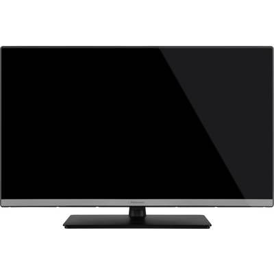 Ein schwarzer Flachbildfernseher mit dunklem Bildschirm auf einem rechteckigen Standfuß.