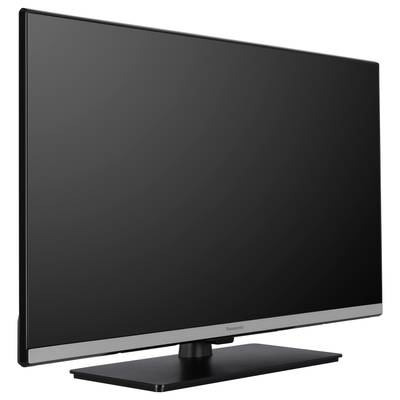 Ein großer Flachbildfernseher mit schwarzem Rahmen und einem silbernen Streifen an der Unterkante, auf einem breiten Standfuß.