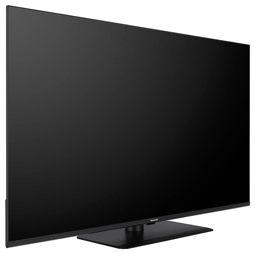 Ein schwarzer Flachbildfernseher auf einem rechteckigen Standfuß, der nach rechts zeigt.