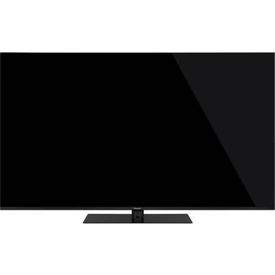 Flachbildfernseher mit schwarzem Bildschirm, auf einem rechteckigen Standfuß montiert. Geeignet für modernes Wohnzimmerdesign.