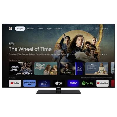 Ein Fernseher zeigt das Interface eines Streaming-Dienstes mit 'The Wheel of Time' als hervorgehobene Serie, umgeben von weiteren App-Icons.