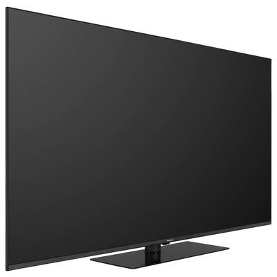 Flacher, schwarzer Fernseher von der Seite gesehen auf einem rechteckigen Standfuß.
