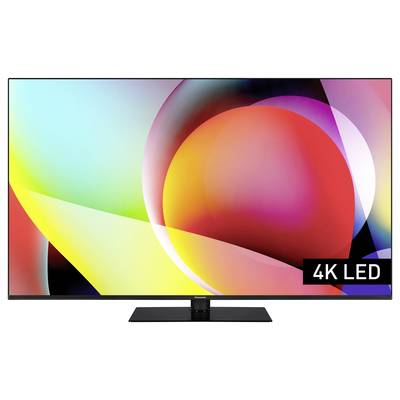 'Farbenfroher TV-Bildschirm mit abstraktem Design, zeigt 4K LED-Modell. Lebendige Kreise und Formen in Rot, Gelb und Lila.'