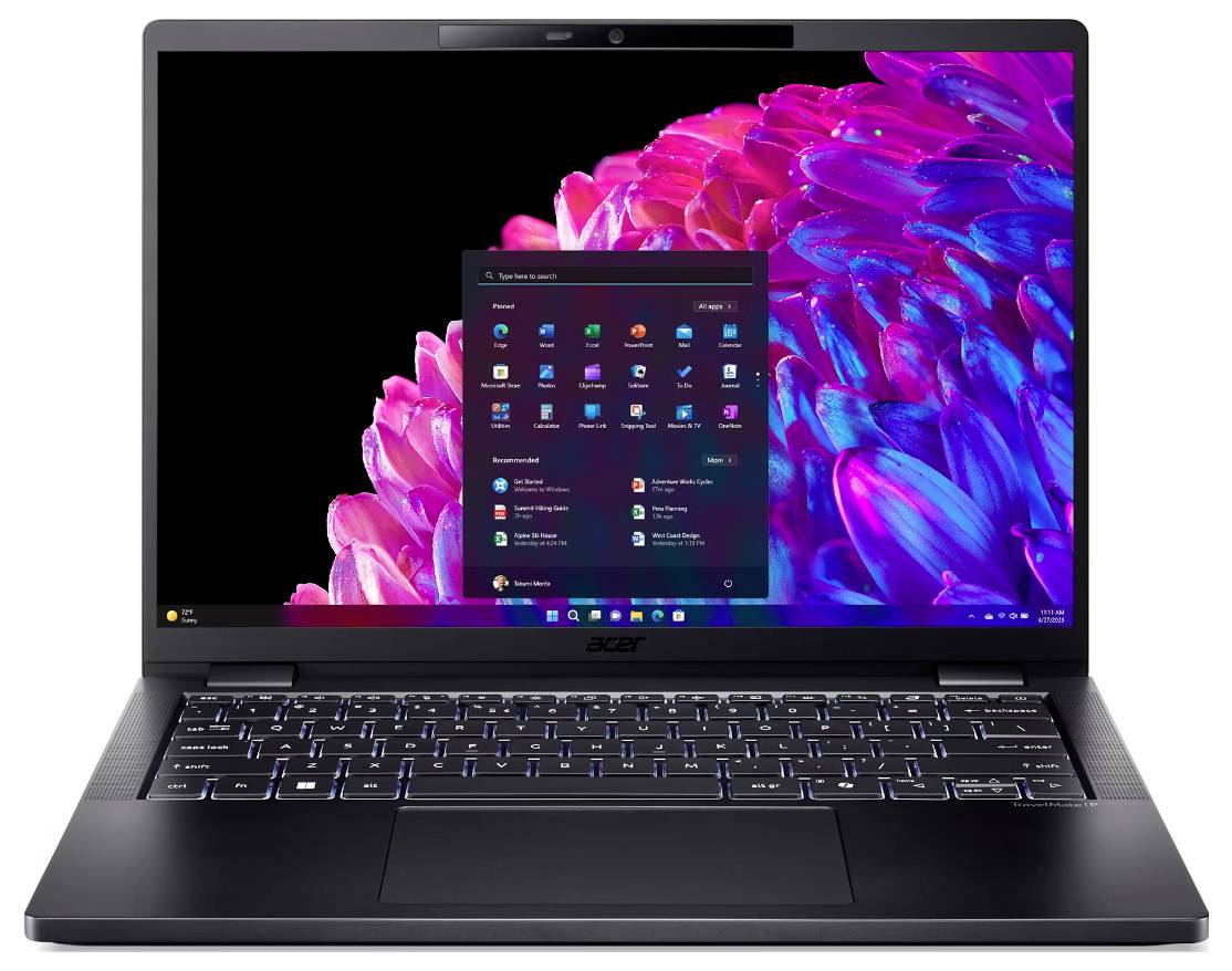 Ein Laptop mit aktiviertem Bildschirm. Hintergrund zeigt helle, blumenartige Strukturen. Das Startmenü von Windows ist geöffnet.