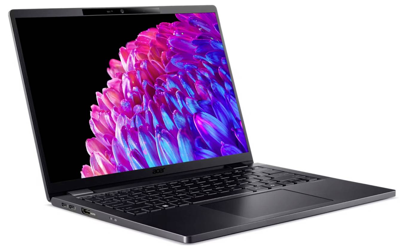 Ein Laptop mit schwarzer Tastatur und einem Bildschirm, der bunte, blütenartige Formen in Pink und Blau zeigt.