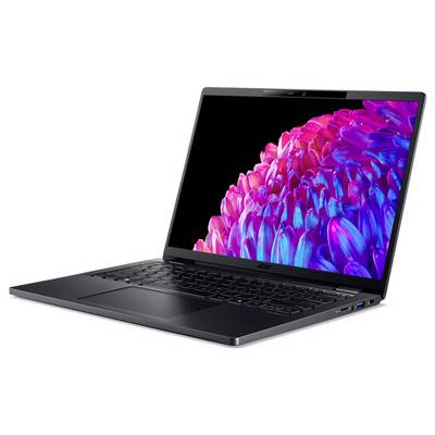 Ein Laptop mit geöffnetem Bildschirm zeigt ein farbenfrohes, abstraktes Bild mit pinken und violetten Blütenformen auf schwarzem Hintergrund.