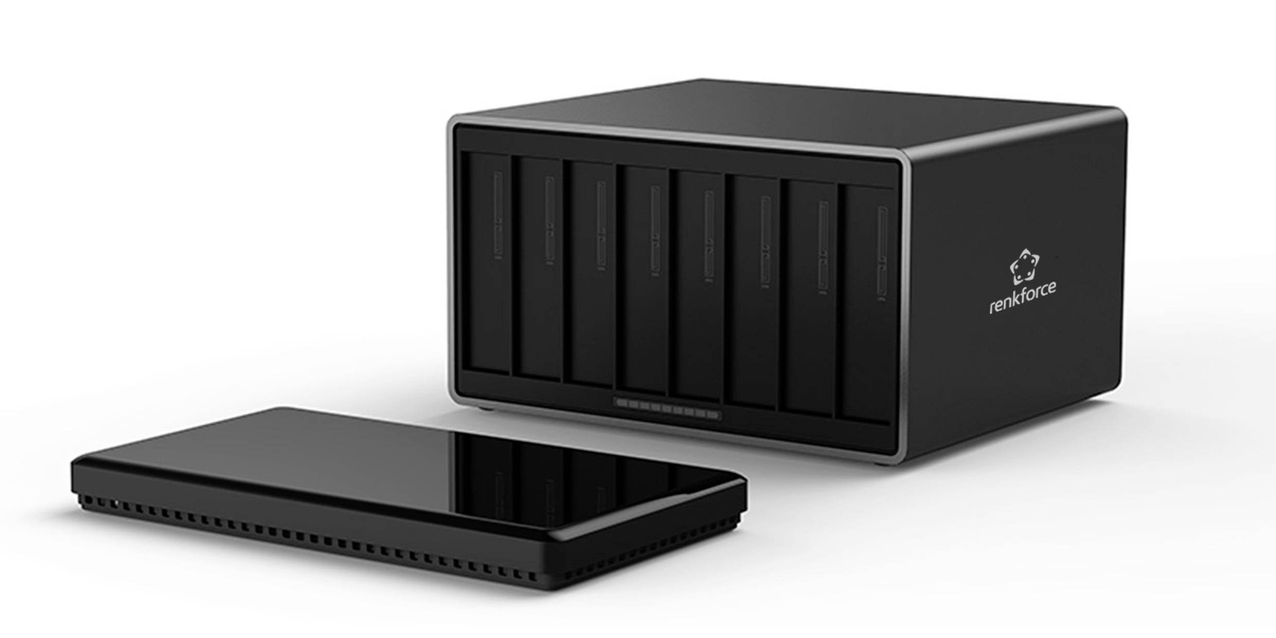 Externe Festplatte und Speichergerät nebeneinander. Schwarz mit mehreren Steckplätzen im Speichergerät.