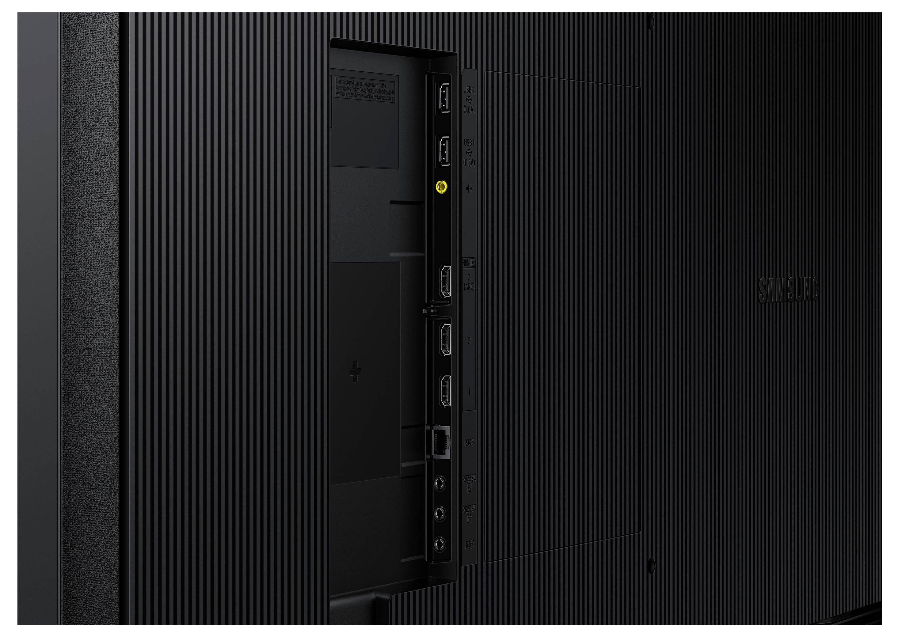 Rückseite eines Fernsehers mit sichtbaren HDMI-, USB- und Audioanschlüssen. Schwarze, geriffelte Oberfläche mit Markenlogo.