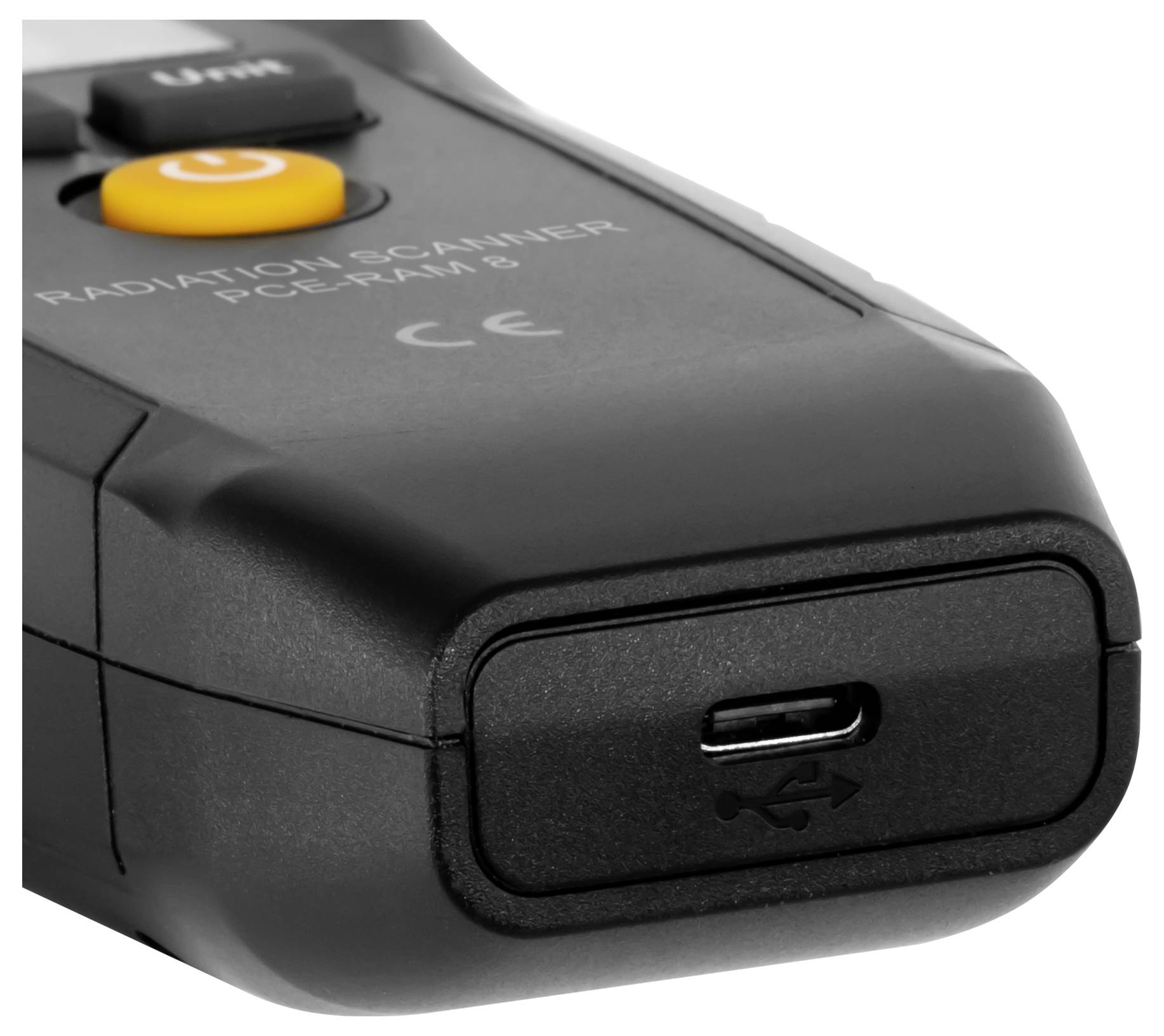 Nahaufnahme eines schwarzen Strahlenmessgeräts mit einem Stromschalter und USB-C-Ladeanschluss.