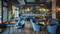 Ein stilvolles, modernes Café mit blauen Sesseln und Holztischen. An der Wand hängen Pflanzen und die Bar im Hintergrund ist beleuchtet.