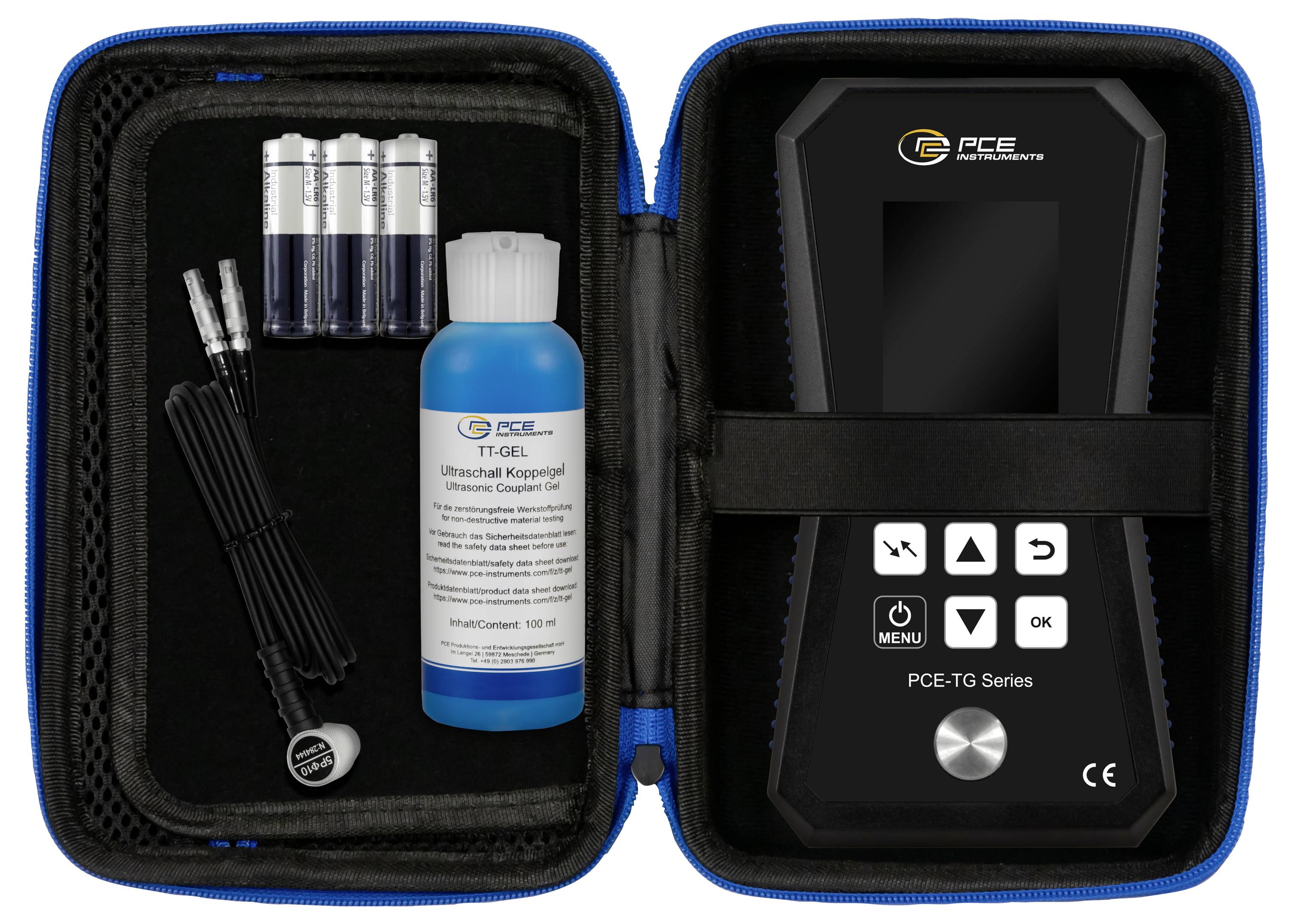 Ultraschall-Dickenmessgerät im geöffneten Etui mit Batterien, Kabeln und Kopplungsgel. Gerät zeigt Tastenmenü.