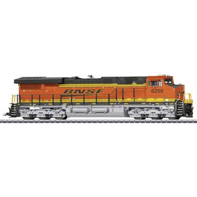 Orange-gelbe Güterlokomotive mit der Aufschrift 'BNSF' auf der Seite. Lokomotive steht auf einem Gleis.