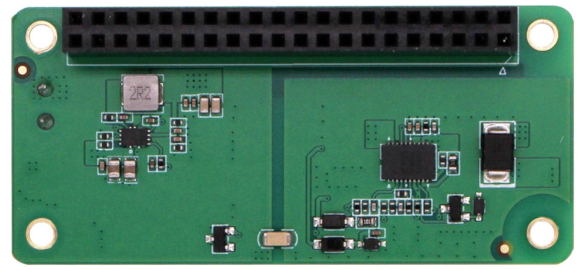 Grüne elektronische Platine mit mehreren kleinen schwarzen und silbernen Komponenten. Oben ist ein schwarzer Steckverbinder platziert.