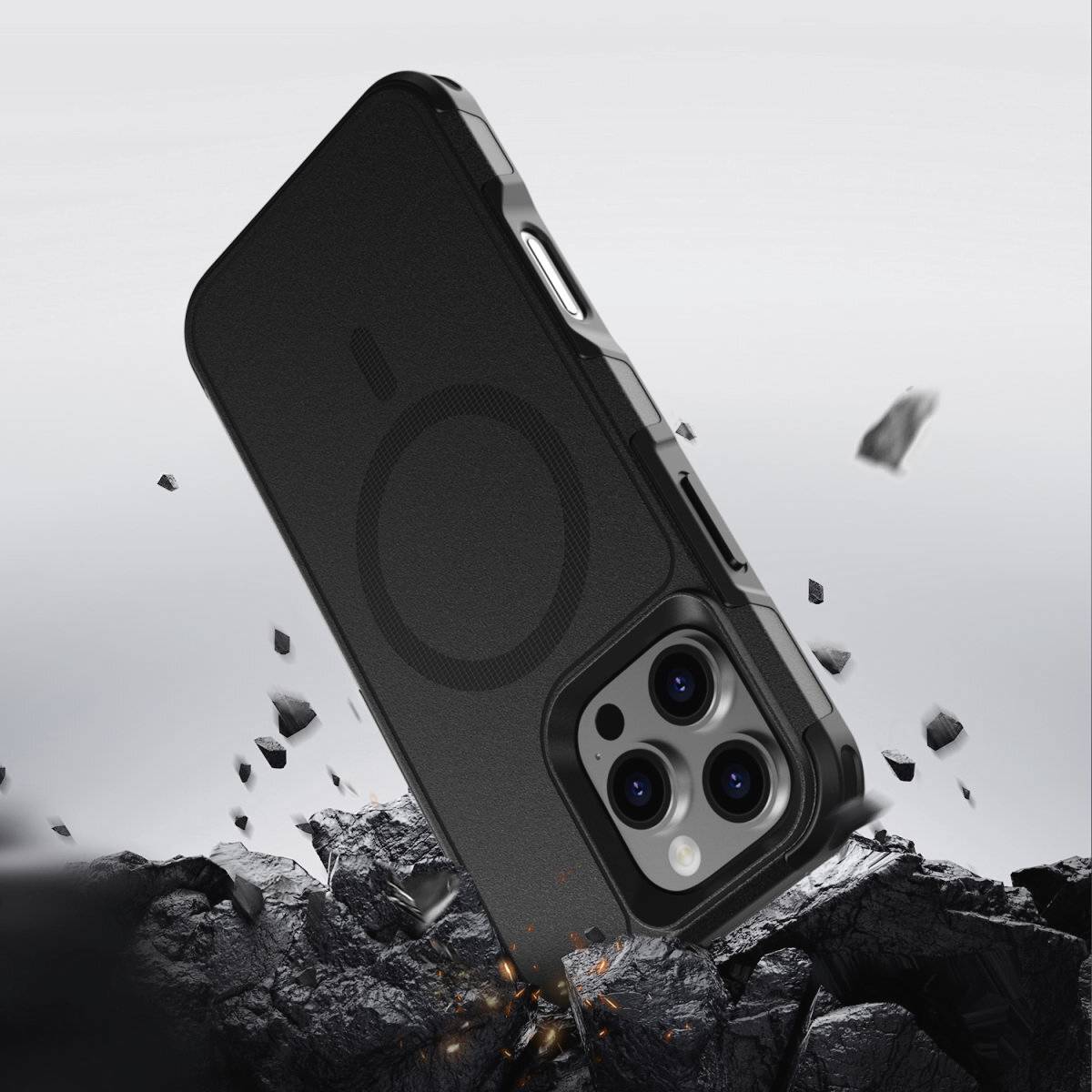 Ein schwarzes Smartphone mit Schutzhülle schwebt über zerbrochenen Steintrümmern, was Robustheit und Stoßfestigkeit symbolisiert.