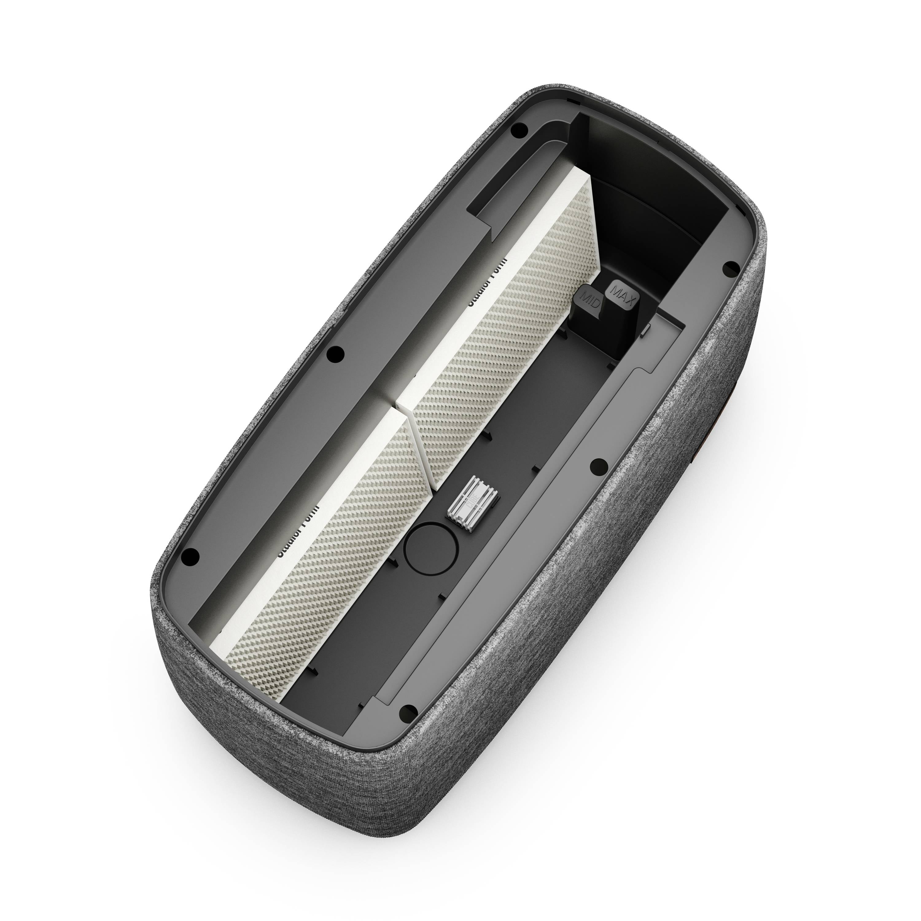 Die Abbildung zeigt das Innere eines Lautsprechers mit zwei sichtbaren Filtern und einem Steckplatz für Kabelverbindungen.