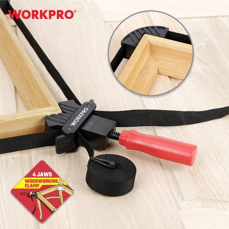 'WORKPRO' Ecken- und Rahmenspanner für Holzarbeiten, roter Griff, schwarze Klemme, runde Vergrößerung des Klemmmechanismus.