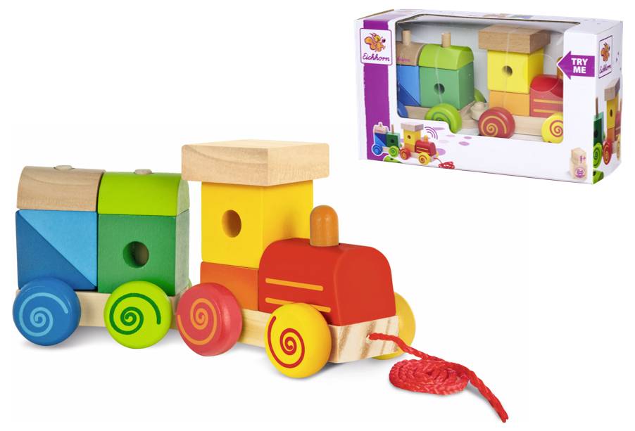 Ein bunter Holzspielzeugzug mit roten, gelben und grünen Elementen. Verpackung zeigt den Zug und lädt zum Spielen ein.