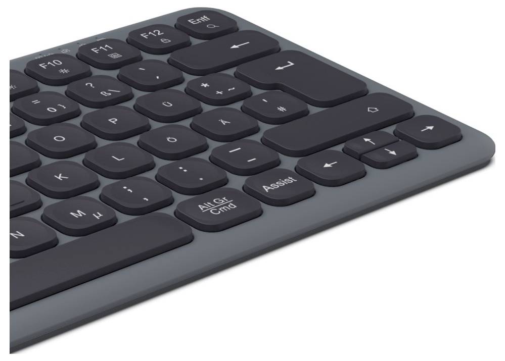 Schwarze Computertastatur auf grauem Untergrund, zeigt Tasten für Steuerung und Eingabe.