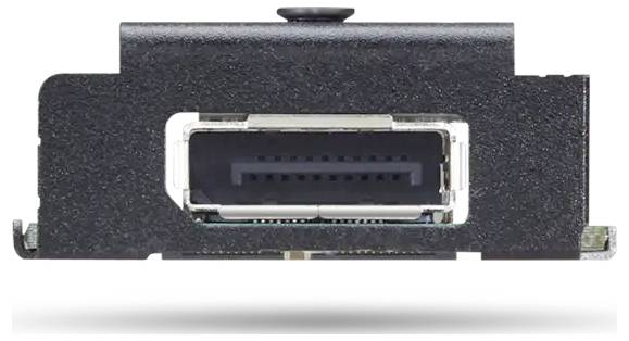 Ein schwarzer elektronischer Anschluss mit rechteckiger Form, montiert auf einer flachen Oberfläche.