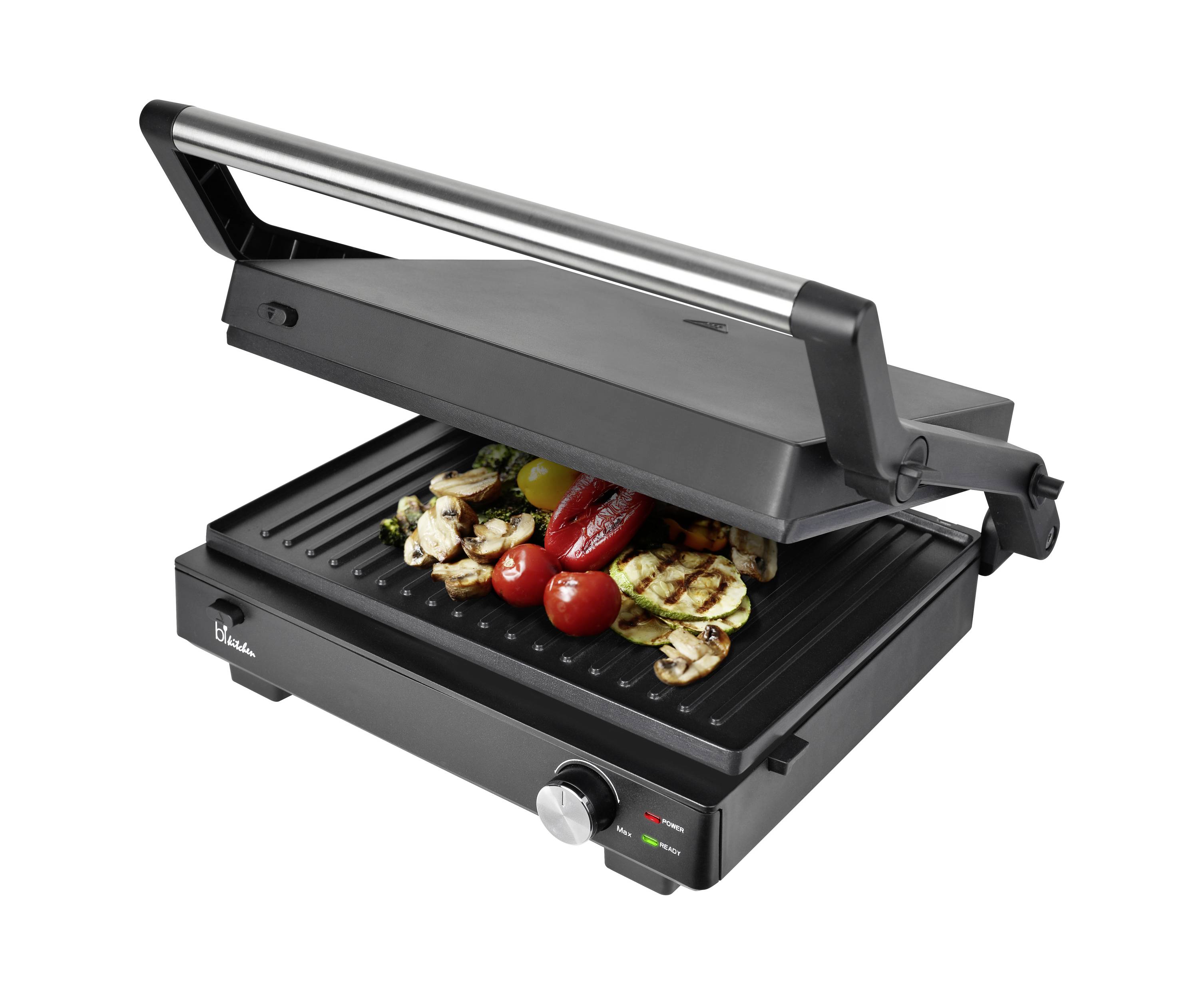 Ein elektrischer Grill mit offenem Deckel grillt buntes Gemüse wie Paprika, Zucchini und Pilze.