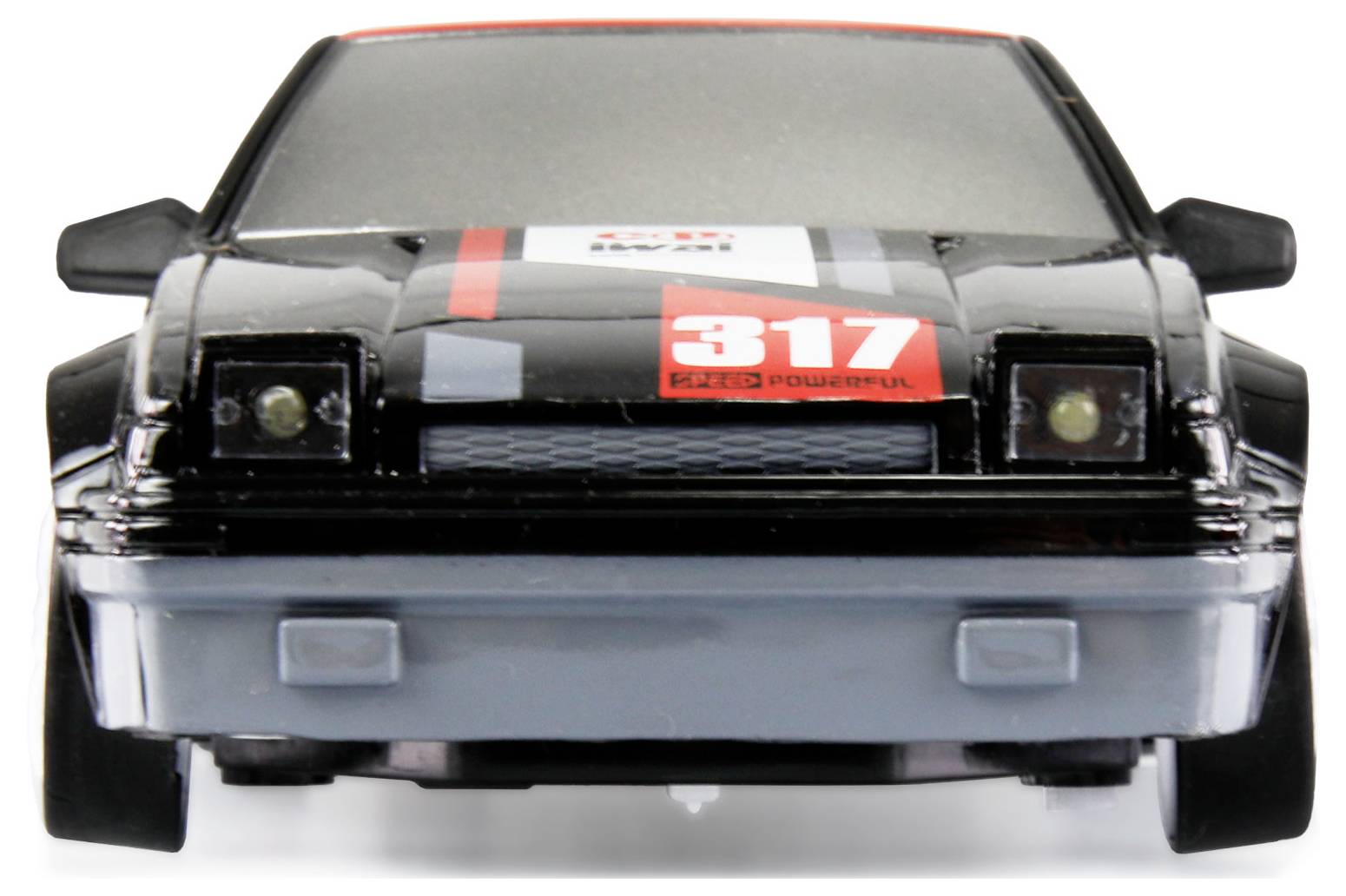 Ein schwarzes Spielzeugauto mit der Nummer '317' vorne auf der Motorhaube, rotem Streifen und quadratischen Scheinwerfern.