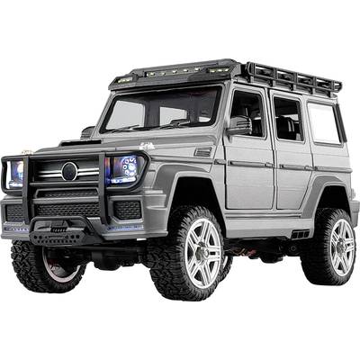 Ein grauer Spielzeug-Geländewagen mit robustem Design, blauen Scheinwerfern und detaillierten Rädern steht im Fokus des Bildes.