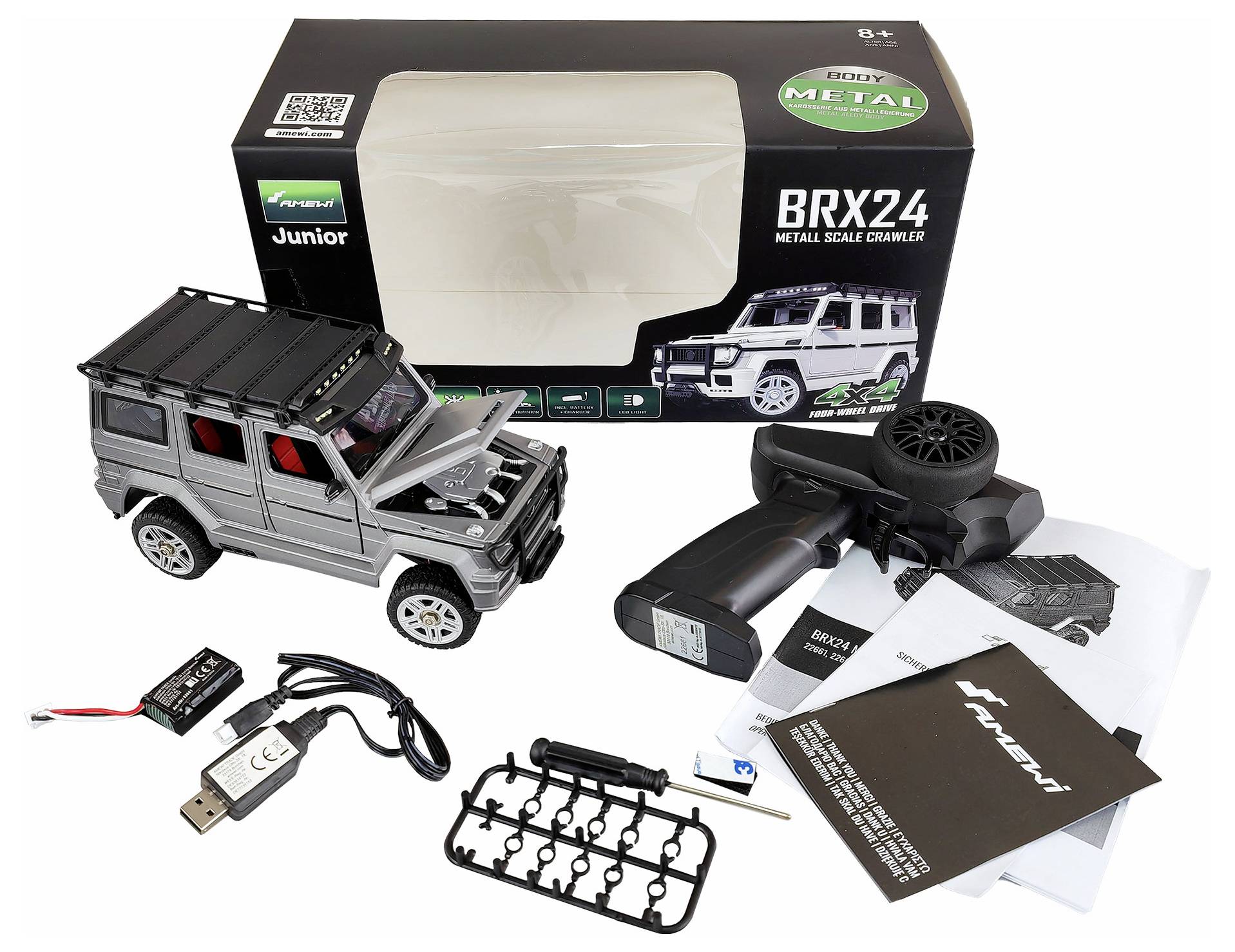 Ferngesteuertes Auto 'BRX24 Metal Scale Crawler' mit Fernsteuerung, USB-Ladekabel und Zubehör, dargestellt neben der Verpackung.