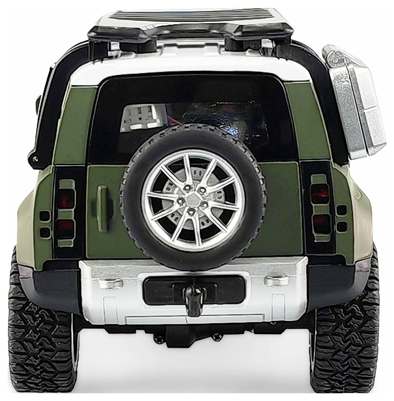Ein Modellauto in Grün und Weiß, von hinten gezeigt, mit Reserverad und markanten Offroad-Reifen.