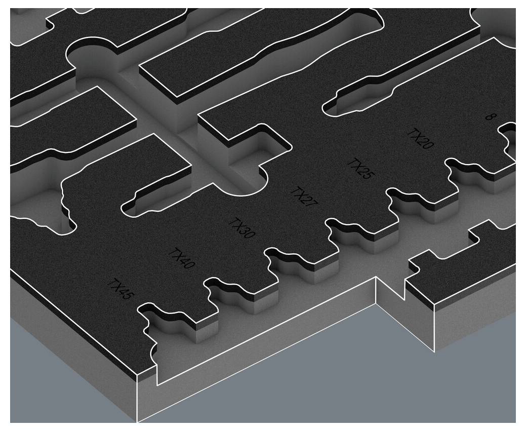 Ein schwarzes Kunststoffteil mit präzisen Aussparungen und Beschriftungen ('10X5', '7X80', '7X60', etc.) auf einer grauen Oberfläche.