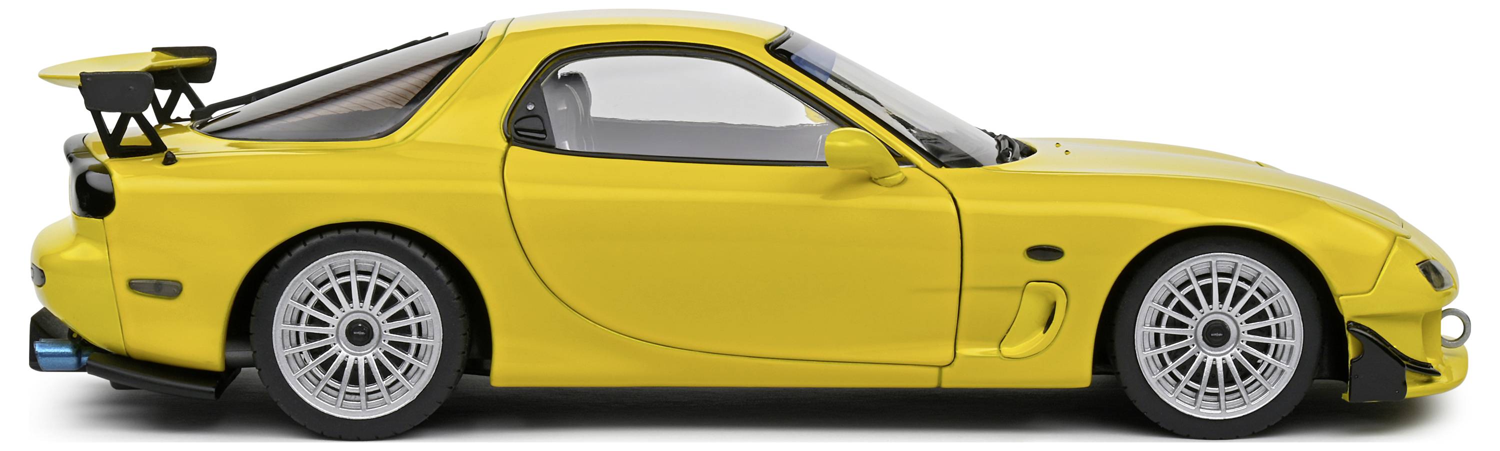 Gelber Sportwagen in Seitenansicht, Modell RX-7 mit großem Heckspoiler und eleganten Linien, auf weißem Hintergrund.