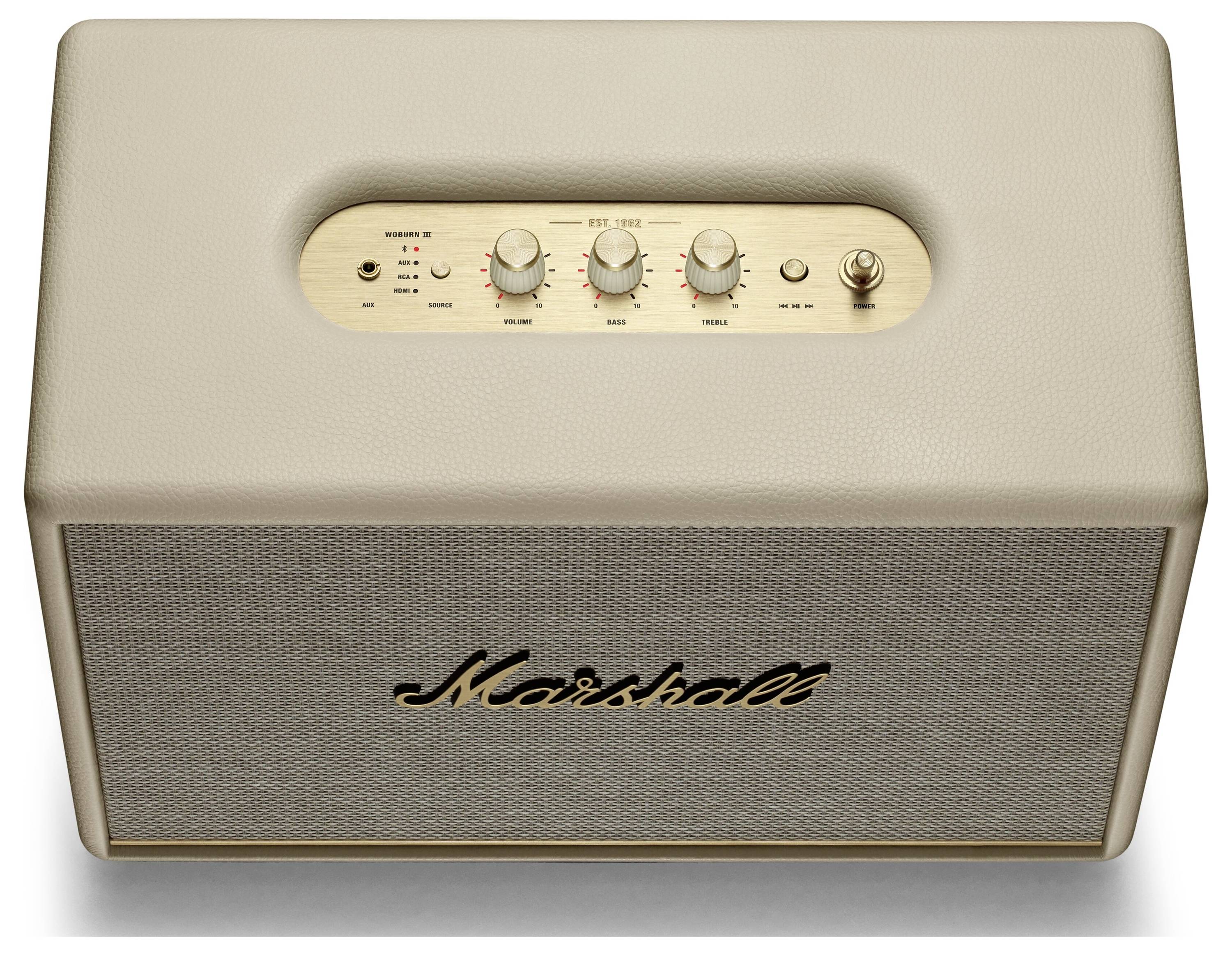 Ein beiger Marshall-Lautsprecher mit goldener Bedienfläche und drei Drehknöpfen für Lautstärke, Bass und Höhen.