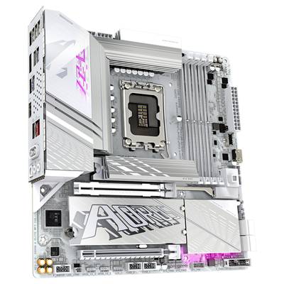 Ein silbernes Computer-Motherboard mit dem Schriftzug 'Aorus', CPU-Steckplatz in der Mitte, PCIe-Steckplätze und mehreren Kühlkörpern.