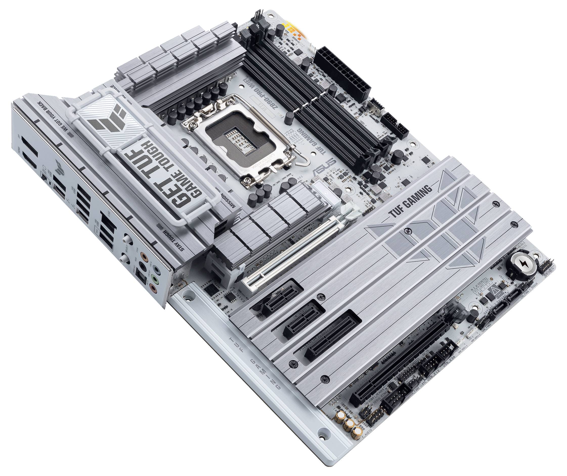 Ein silbernes Mainboard mit mehreren Erweiterungssteckplätzen und RAM-Bänken. Aufschrift: 'TUF Gaming'. Ports und Anschlüsse sichtbar.