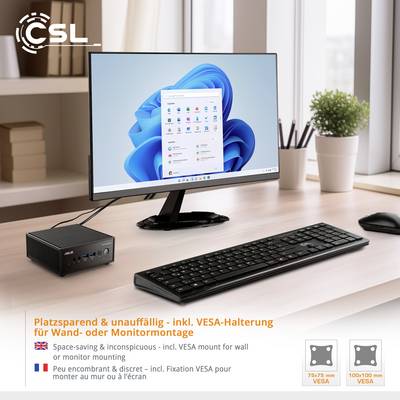 Ein schwarzer Minicomputer neben Monitor mit Windows-Bildschirm. Text betont platzsparend und unauffällig, geeignet für Wandmontage.