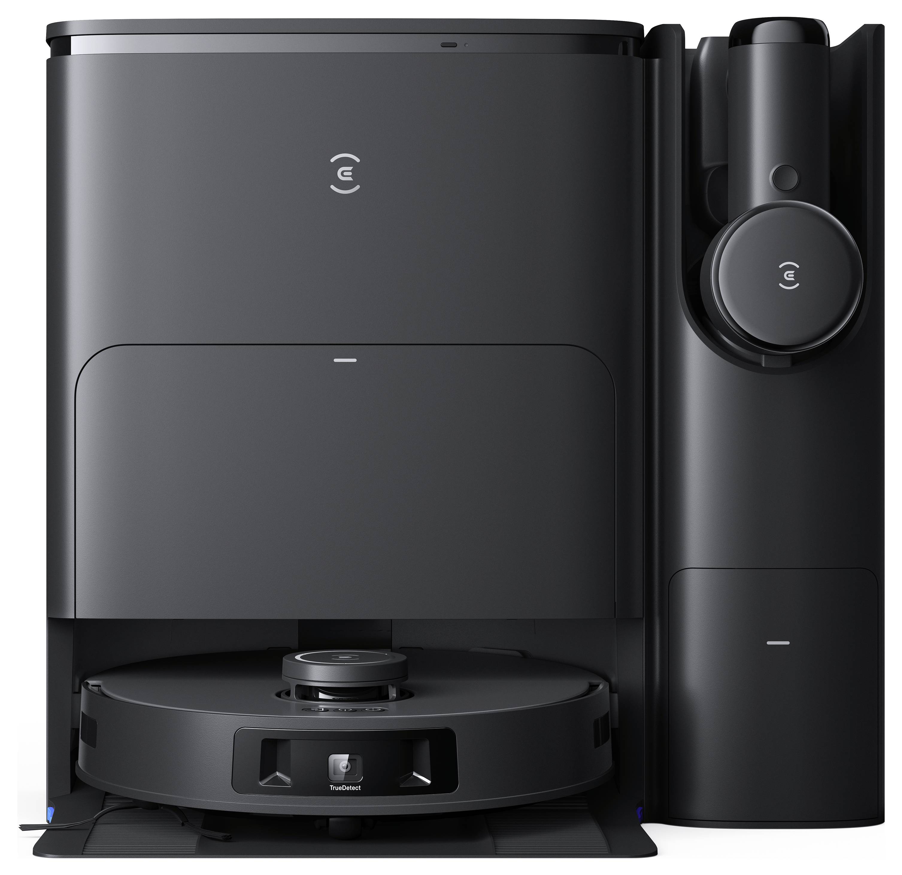 Ein schwarzer Roboter-Staubsauger und seine Ladestation. Der Staubsauger steht vor der Station und ist bereit zur Verwendung.