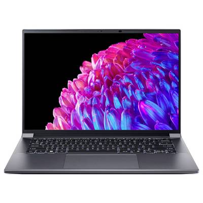 Laptop mit Bild eines bunten, abstrakten Blütenmotivs auf dem Bildschirm.