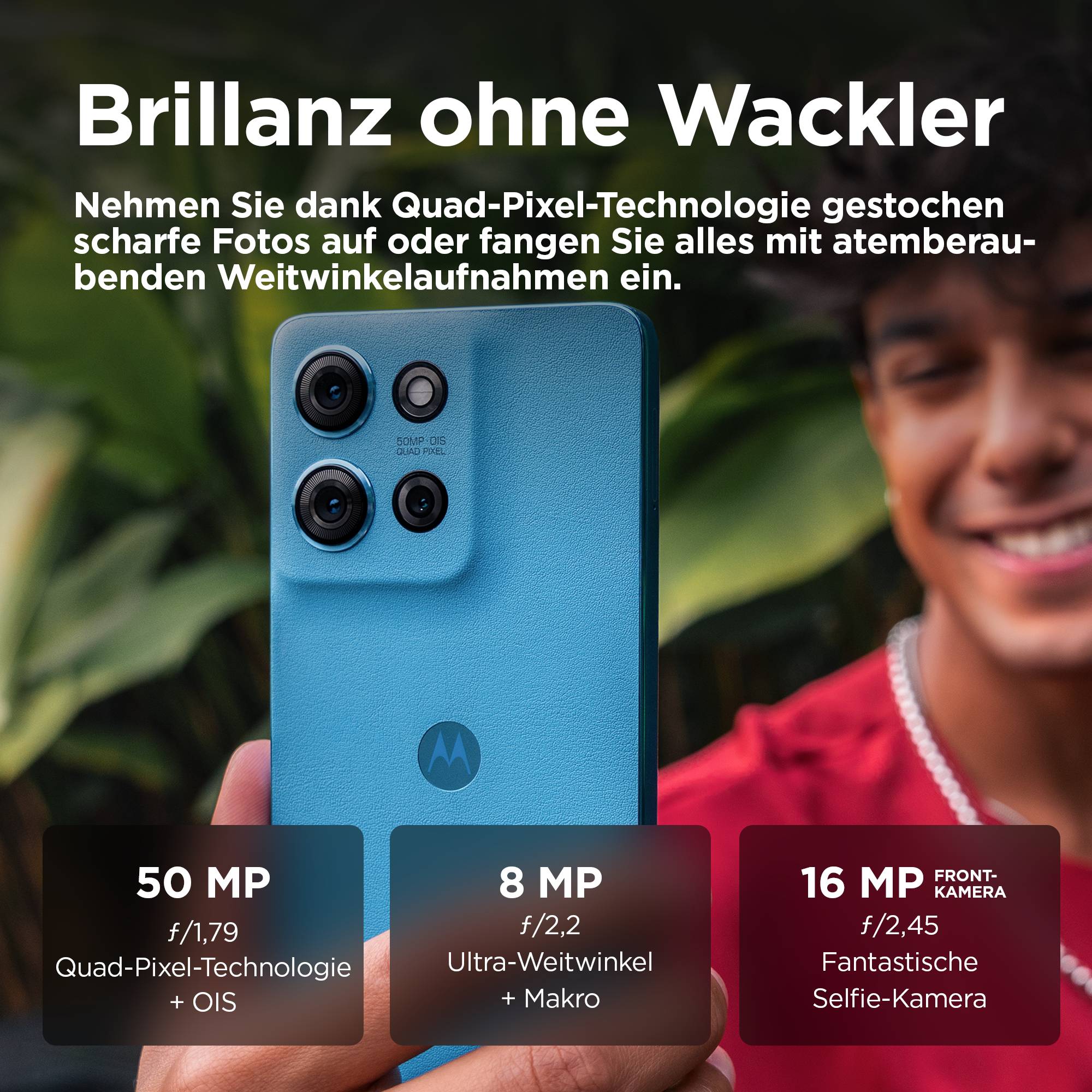 Smartphone in Blau mit vier Kameraobjektiven. Text: 'Brillanz ohne Wackler'. Hauptkamera: 50 MP, Weitwinkel 8 MP, Frontkamera 16 MP.