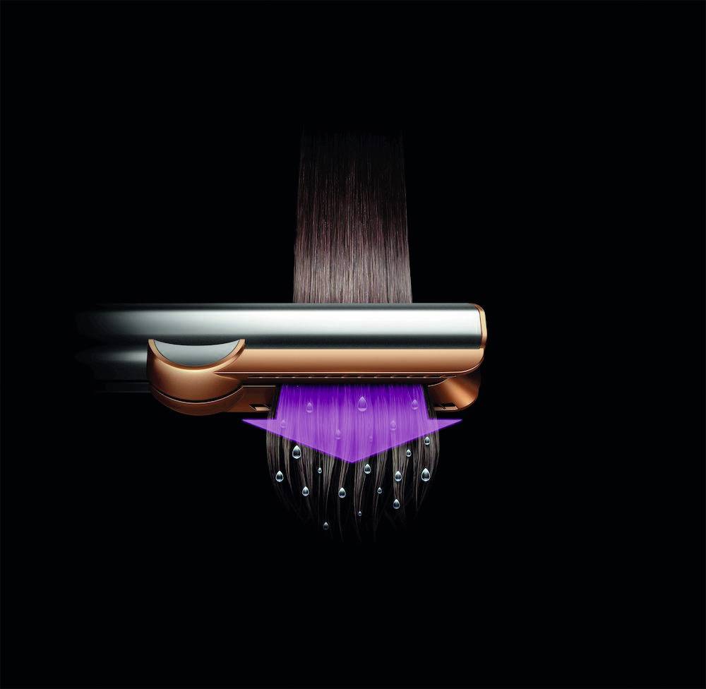 Ein langer, vertikaler Mikrofon mit einem modernem, glänzenden Design und einem Kabel an der Unterseite.