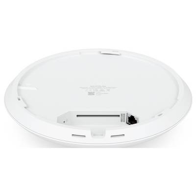 Die Unterseite eines runden Geräts mit einem Ethernet-Anschluss und einem Fach. Es könnte sich um ein technisches Gerät wie einen Router handeln.