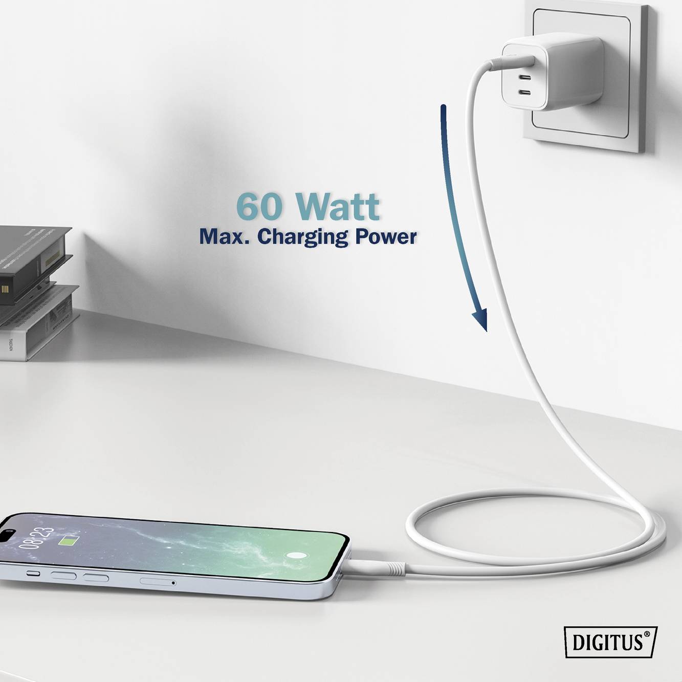 Ein Smartphone wird mit einem weißes Kabel auf einem Tisch aufgeladen. Über dem Kabel steht 'Max. 60 Watt Charging Power'.