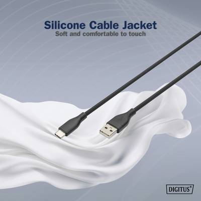 'USB-Kabel mit Silikonmantel, weich und angenehm zu berühren.' Kabel auf weißem Stoff, im Hintergrund ein digitales Gitternetzmuster.