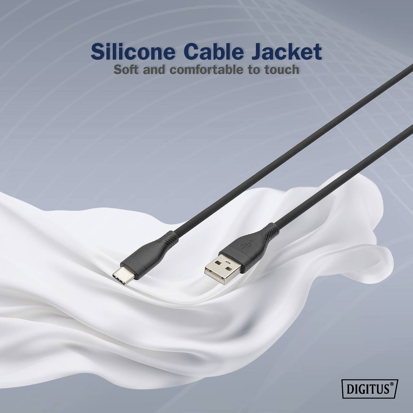 USB-Kabel mit Silikonmantel auf weißem Stoff. Text oben: 'Silicone Cable Jacket - Soft and comfortable to touch'. Markenname unten rechts.