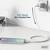 Ein Smartphone wird mit einem Ladekabel an eine Steckdose angeschlossen, Text zeigt '60 Watt Max. Charging Power'.
