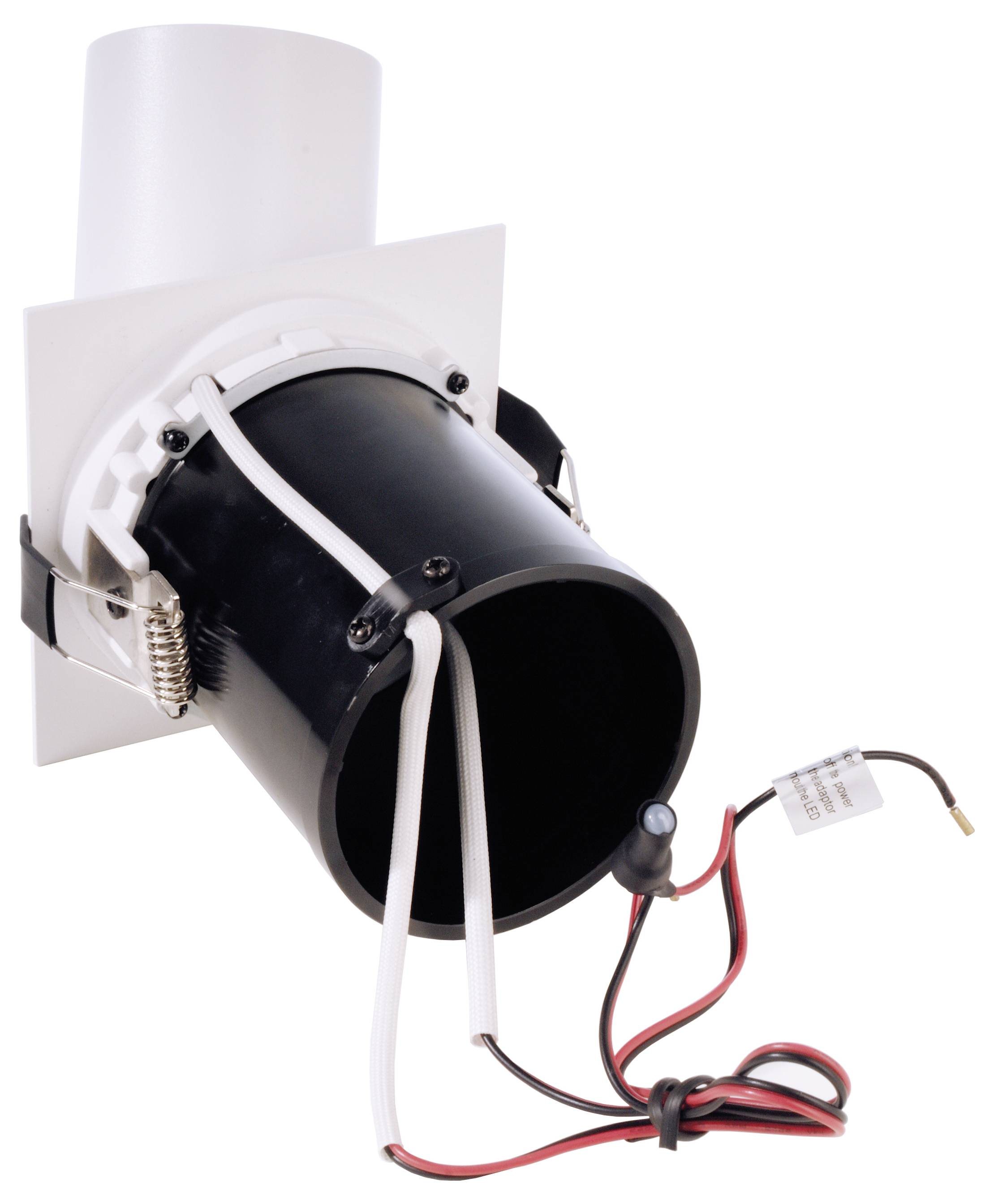 Ein schwarzes zylindrisches Gerät mit Drähten und Steckern, möglicherweise eine elektronische Komponente oder ein Beleuchtungsteil.